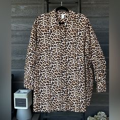 This H&M Tunic Top In Size Xxl Features A Trendy Leopard Print And An Oversized Fit For A Comfortable And Stylish Look. The Long-Sleeved Button-Up Top Has A Collared Neckline And Is Made Of 100% Cotton Material. Measures Approximately 34” Flat Across Bust And Approximately 34” In Length. Has Chest Pocket. Item Is New Without Tags. All Sales Are Final/No Returns. Thank You. Oversized Brown Tops With Buttons, Oversized Brown Cotton Blouse, Oversized Brown Collared Blouse, Brown Oversized Button-up Top, Brown Oversized Button-up Blouse, H&m Collared Blouse For Fall, H&m Fall Blouse With Button Closure, Fall H&m Blouse With Button Closure, H&m Brown Long Sleeve Tops