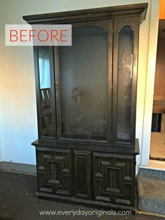 an old china cabinet has been painted black