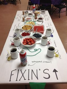 the table is set up with many different foods and drinks for people to enjoy it