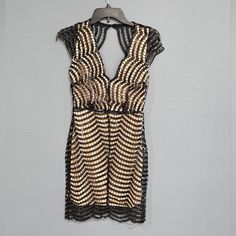 Nwt. Size Is S But May Fit Like An Xs. 100% Polyester Sequined Crochet Lace Over Nude Lining. Back Zipper. Gold Hardware. Flat Measurements: Chest: 16" Waist: 12" Hips: 18 Length Approx: 35 " Party Crochet Dress With Lace Trim Mini Length, Lace Crochet Mini Dress For Party, Chic Crochet Mini Dress For Night Out, Stretch Crochet Dress With Hollow Out Details For Party, Stretch Crochet Dress With Hollow Out For Party, Chic Crochet Dress With Lace Trim For Party, Fitted Crochet Dress For Spring Party, Party Crochet Dress With Hollow Out Details, Fitted Sleeveless Crochet Evening Dress