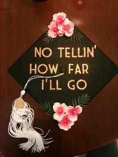 a graduation cap with flowers on it that says, no tellin'how far i'll go