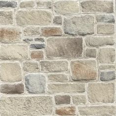 a stone wall with several different colored bricks