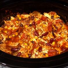 a crock pot filled with chili and beans