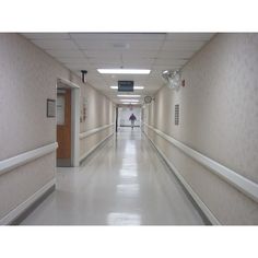 an empty hospital hallway with no people in it