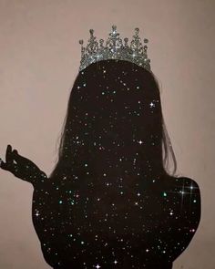 the silhouette of a woman with a crown on her head and stars all over it