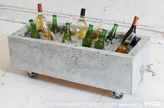 a metal container filled with lots of bottles