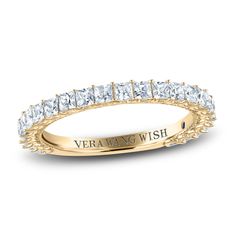 a yellow gold wedding band with princess cut diamonds in the center and an inscription vera ring wish