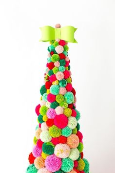 a christmas tree made out of pom - poms