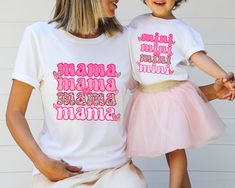 Mama Mini Matching Shirt, Mothe's Day Gift, Mama Tshirt, Mom and Baby Shirt, Mommy And Me Shirt, Family Matching Shirt, New Mom,Mom Daughter ❀DETAIL❀ For printing, we use Bella Canvas and Gildan SoftStyle brand shirts, which are the best in the industry. *Bella Canvas -unisex size -4.2 oz. -Solid colors are 100% Combed Cotton and Ring-Spun Cotton. -Athletic Heather 90% Combed and Ring-Spun Cotton, 10% Polyester -All Heather CVC Colors 52% Combed and Ring-Spun, 48% Polyester *Gildan SoftStyle -un Playful Tops With Funny Print For Mother's Day, White Top With Funny Text For Mother's Day, Playful Name Print Tops For Mother's Day, Playful Mother's Day Tops With Funny Print, Playful Tops With Name Print For Mother's Day, White Tops With Funny Text For Mother's Day, Fun Short Sleeve Shirt For Mother's Day, Playful Pink Tops For Mother's Day, White Top With Custom Parenting Print