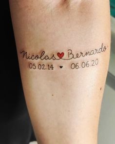 a woman with a tattoo on her arm that reads nicholas bernard 05 01 04 20