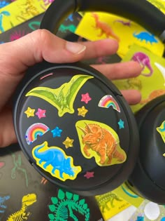 Black sony headphones with colorful glitter dinosaur and stars stickers Dino Core Aesthetic, Dinosaur With Headphones, Sticker Headphones, Dinosaur Aesthetic, Dinosaur Stuff, Mesozoic Era, Dinosaur Stickers, Cute Crafts, Jurassic World