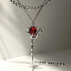 Description: Welcome to our collection of exquisite stainless steel jewelry, where elegance meets innovation. Behold our stunning Double Layer Rose Pendant Necklace, a true testament to beauty and craftsmanship. Crafted with precision and care, this necklace features a unique design with double layers of delicate rose pendants, each adorned with vibrant red zircon stones. The intricate detailing and irregular floral aesthetic make this piece a standout addition to any jewelry collection. The red zircon stones add a pop of color and sparkle, elevating the necklace to a new level of sophistication. Whether you're dressing up for a special occasion or adding a touch of glamour to your everyday look, this necklace is sure to turn heads and spark conversations. Designed to be versatile and time Egirl Necklace, Collar Rosa, Rose Pendant Necklace, Flower Choker Necklace, Beaded Tassel Necklace, Flower Choker, Dark Rose, Star Chain, Rose Pendant