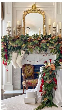 a fireplace decorated with christmas garland and stockings