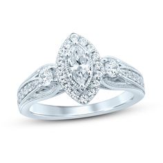 a white gold engagement ring with diamonds on it