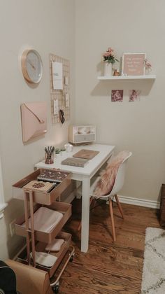 a white desk and chair in a small room