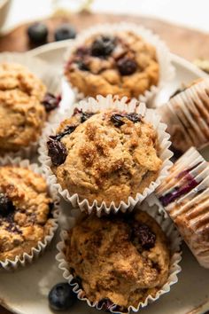 blueberry muffins on a plate with other muffins