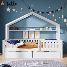 a child's bedroom with blue walls and stars on the ceiling, white bed frame