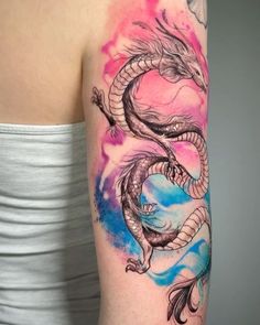 a woman with a dragon tattoo on her arm