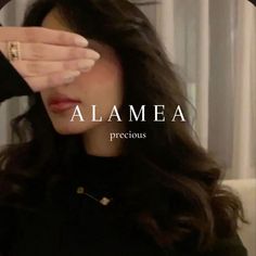 a woman holding her hand up to her face with the words, alammea precious precious