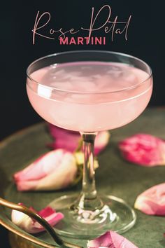 a martini in a glass with rose petals on the rim and text reading rose petal martini