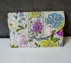 This is a classic retired pattern envelope style vintage wallet from VERA BRADLEY: Pattern name "WATERCOLOR" A pretty floral cotton fabric in shades of lavender, purple, white, black, silver gray, yellow and greens Size: Closed 5" x 7. 25" Inside: 2 bill size open pockets / 1 ID slot and case / I zippered coin purse with silver signature circle pull    Wallet snaps closed with an invisible magnetic stud Condition:  Excellent throughout / extremely lightly used A useful and pretty Vera Bradley wallet in lovely colors #684/20/49 Professionally packed and shipped This is a non-smoking and pet-free establishment Thanks so much for visiting my shop and for supporting my small business :) Phone Cards, Vera Bradley Wallet, Travel Wallet, Clip Wallet, Money Clip Wallet, Travel Wallets, Pattern Names, Lovely Colors, Magnetic Closure