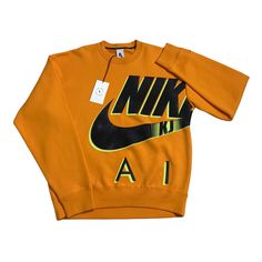 Nike x Kim Jones NRG AM Fleece Crew Adult Unisex SZ Small Orange DD0692-804 NWT Nike and Kim Jones take on the spirit of ’95 with this clean Nike x Kim Jones crewneck sweatshirt.  Nike Air sweater is made with a warm and heavyweight feel offering a "Nike Air" graphic with details honoring the look of the Air Max 95. Nike Fleece Crew x Kim Jones - Brushed-back fleece - Slightly dropped shoulder seams - Ribbed cuffs - 84-85% cotton, 15-16% polyester. Take a look at the pictures for details + Free