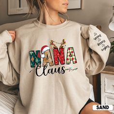 Nanai Claus is a popular Christmas character that your grandma will love. This sweater sweatshirt is perfect for keeping her warm this winter. Add a little bit of fun to your gift-giving with this unique Nana Claus product personalized with grandkids names on sleeve. Your grandma will love wearing her Nana Claus sweatshirt this holiday season. * S I Z I N G * ✺ Sizing is unisex  ✺ For adults, size runs like men's, though not overly large. Most women find their typical size works best, since they are meant to fit a touch loose and go up 1 or 2 sizes if you want the oversized look. ✺ Size guide and fit:  The size chart is listed in photos above.  Please use the measurement for the most accurate sizing. ✺ Product color may slightly vary due to photographic lighting sources or your monitor set Christmas Gifts For Aunts, Auntie Shirts, Aunt Shirts, Kids Names, Personalized Grandma, Nana Gifts, Mama Shirts, Sweat Shirts, Gift For Grandma