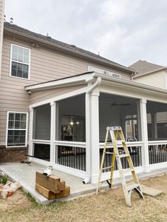 a house that is being built with some windows on the front and side of it