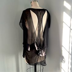 Nwot Never Worn Nameless Sheer Black Polyester Fabric Bow Or Tie In The Back Cut Outs In Back Size Medium Black Sheer Beach Top, Summer Black Daywear Tops, Black Summer Blouse For Layering, Sheer Back Tops For Night Out In Summer, Sheer Back Top For Night Out In Summer, Summer Tops With Sheer Back For Night Out, Black Top With Sheer Back For Night Out, Chic Black Top For Daywear, Black Polyester Fabric