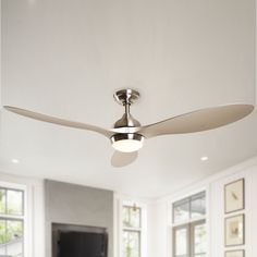 a ceiling fan in a white living room