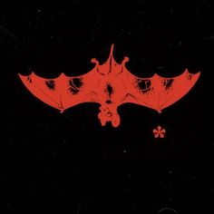 a red bat flying through the air on top of a black background with white flowers