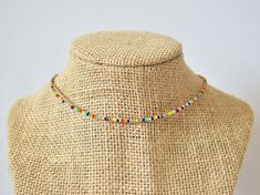 The This Colorful beaded choker is a fun accessory with colors that match every outfit. This necklace gives you a splash of color that will brighten your day! The standard bedazzling choker is 13 inches long with an adjustable 2-inch extender chain to comfortably fit any size neck. If you would like a different length, please select the length you would like and I'll be happy to adjust it! Perfect for layering with other necklaces or chokers and great to wear with any outfit. It is carefully cra Colorful Letter Beads For Festival, Festival Multicolor Letter Beads, Adjustable Multicolor Beaded Chain Choker, Adjustable Multicolor Beaded Choker, Multicolor Choker With Round Letter Beads, Multicolor Letter Beads Choker With Round Beads, Multicolor Letter Beads Choker, Multicolor Tiny Beads Choker For The Beach, Multicolor Bead Choker For Gift