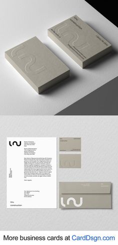 some business cards and envelopes on top of each other