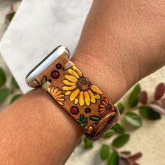 "Fall Flowers and Leaves Apple Watch Band This is a personalized, made to order listing; please allow time for its creation. Just click the Shipping & Policies tab to view our current production turnaround time. In notes to seller list your initials and color scheme (where applicable) and your new watch band will be made just for you! Stained in a rich brown with hand painted accent colors. Flowers will be hand painted yellow and orange unless otherwise specified in the notes to seller. If y Leather Apple Watch Band, New Watch, Apple Watch Bands Leather, Fall Flowers, Apple Watch Band, Flowers And Leaves, Leather Band, Apple Watch Bands, Accent Colors