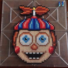 an image of a clown made out of perler beads