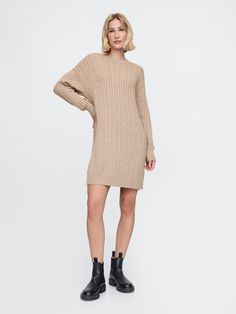 Supersoft cotton-blend cable-knit sweater dress.  Crewneck.  Long sleeves with drop shoulders.  Ribbed hem.  Fit: Over Sweater Dress Brown, Plush Yarn, Cable Knit Sweater Dress, Mini Sweater, Everyday Luxury, Everyday Luxuries, Mini Sweater Dress, Knit Sweater Dress, Toddler Gifts