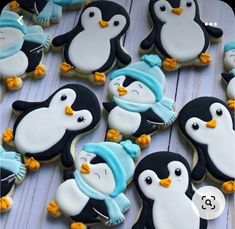 some decorated cookies with penguins on them