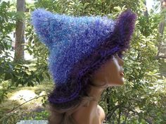 One of a kind purple fuzzy witch hat.  An awesome accessory for your next holiday party, to wear to your favorite festival or cosplay event, or to wear just because your feeling a little witchy.  Great for men or women or to give as a gift. Created with dark purple acrylic yarn and several shades of purple eyelash yarn. Hand wash gently with a mild detergent and lay flat to dry. 16" brim to tip fits most adults or teens Dark Purple Acrylic, Cosplay Headpiece, Hat Cosplay, Wizard Hat, Purple Acrylic, Eyelash Yarn, Pixie Hat, Festival Hat, Costume Hats