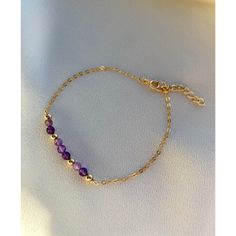 **DESCRIPTION** Delicate gold filled bracelet with micro-faceted sparkly amethyst beads. Individually selected high quality gemstones make the bracelet truly special and one of a kind. The delicate and minimalist design goes well with both casual and sophisticated looks. Wear it by itself or stacked up with other minimalist bracelets available at the shop. **MATERIALS** - 14kt gold filled chain, 14kt gold filled clasp and chain extender (1 inch) - Amethyst beads (approx. 3mm) **GEMSTONE PROPERTI Elegant Purple Birthstone Beaded Bracelets, Purple Beaded Birthstone Bracelets As Gift, Purple Beaded Birthstone Bracelets For Gift, Purple Birthstone Beaded Bracelets As Gift, Purple Birthstone Beaded Bracelets For Gift, Spiritual Amethyst Beaded Birthstone Bracelet, Adjustable Amethyst Beaded Bracelets With Birthstone, 14k Gold-filled Gemstone Bracelets, 14k Gold Filled Gemstone Bracelets