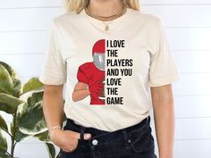 "Swifties and Kansas City football fans alike, get this \"I Love The Players And You Love The Game\" unisex t-shirt to wear to Arrowhead Stadium or your next at home watch party. This Swift and Kelce Shirt makes the perfect gift for the Taylor and Travis fan in your life. PRODUCT DETAILS: - Unisex Jersey Short Sleeve - Made from soft cotton  - Light fabric (4.2 oz/yd² (142 g/m - Tear away label - Runs true to size RETURNS AND EXCHANGES: All of our product are made to order and custom printed, so we do not accept returns or exchanges.  However, if there is an issue with your product, such as a defect or quality issue, please reach out to us and we will do everything we can to make it right for you! We want to make sure all of our customers are more than satisfied with their orders. CANCELLA Taylor Swift Football Party, Next At Home, Football Invitations, Arrowhead Stadium, 1989 Tv, Chiefs Shirts, Taylor Swift Shirts, Kansas City Football, Blank Space