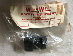 an old hockey equipment box and two pieces of plastic wrap