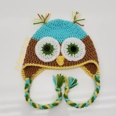 a crocheted owl hat with big eyes