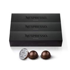 three different types of chocolates sitting in front of a box on a white surface