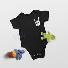 a black bodysuit with two stuffed animals on the front and one in the back