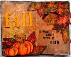 an altered book with autumn leaves and pumpkins on the cover is featured in this image