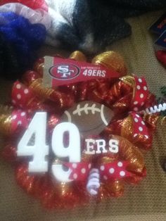 a football wreath with the number 40 on it and other sports related items around it