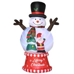 an inflatable snowman with santa clause on top