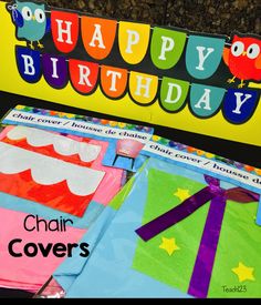 there is a happy birthday sign on the back of a chair with colorful paper decorations