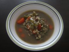 a white bowl filled with soup on top of a table