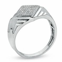 a white gold ring with diamonds on the top and bottom, set in 18k white gold